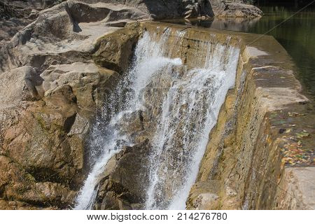 Perfect view waterfall in sunlight. Popular tourist attraction. Discover the world of beauty