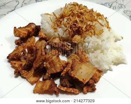 Crispy deep fried prok Thai style with sticky rice