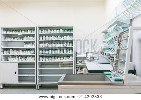 MOSCOW RUSSIA - June 24 2009. Glass jars with rags inside - samples of human blood and sweat. Shelves with material evidences in laboratory of examination human olfactory traces.
