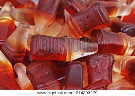 Cola gum candy. Gummy candy cola flavored sweet snack. Cola bottle shaped sweets. Sugar.
