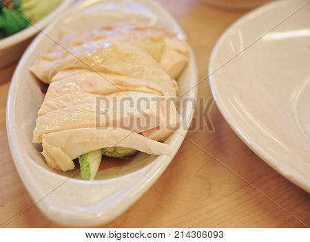 Delicious legendary Singaporean Hainanese chicken rice with two tones dipping sauce