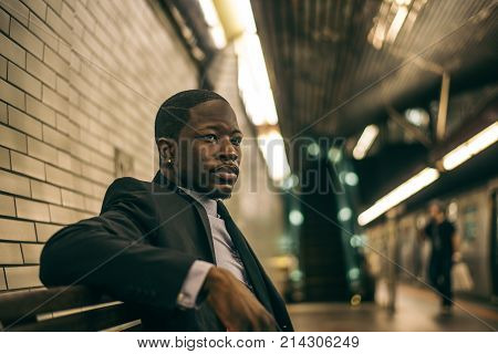 Businessman in full suit in New York subway metro