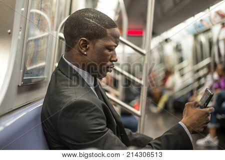 Businessman in full suit in New York subway metro