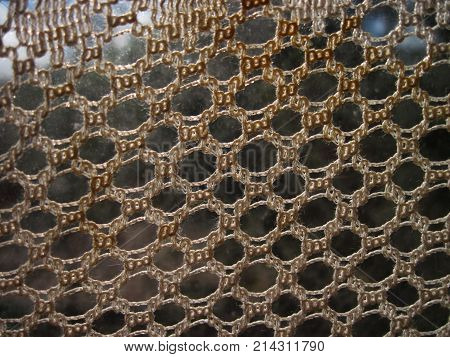 Knitted curtains on window. Focal depth view background