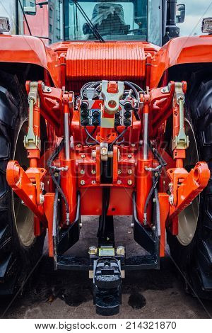 Rear view of modern agricultural tractor. Hydraulic hitch. Lifting frame. Rear mechanism for attaching trailed equipment.