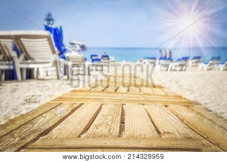 Way to on sandy sea beach on bright sunny day. Path to sea. Summer vacation concept.