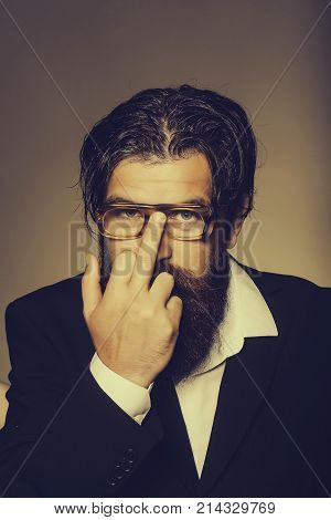 Bearded Man Rearranges Glasses