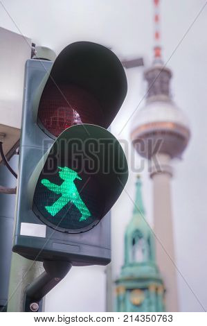 BERLIN - AUGUST 21: Green walking man (Ampelmann) on the traffic light on August 21 2017 in Berlin Germany