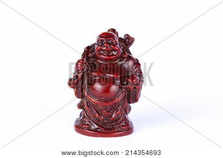 Ceramic figurine wanting on a white background. Buddha is on isolation. A statuette of Zen.