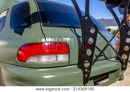 Rear Spoiler Built On A Flat Green Car