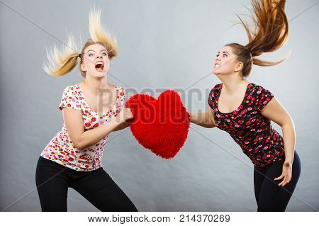 Two Agressive Women Having Argue Fight Holding Heart