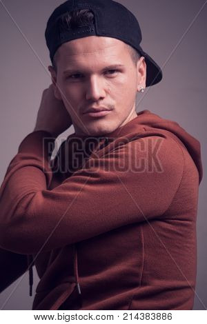 One Young Man, Early 20S,  Boyish Looks, Posing In Studio, Casual Clothes, Sweatshirt Cap, Upper Bod