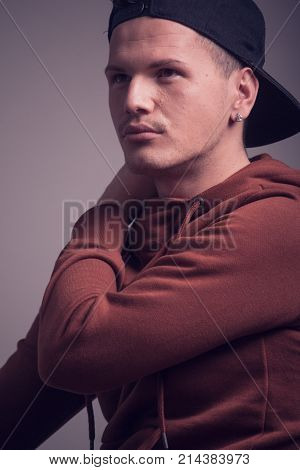 One Young Man, Early 20S,  Boyish Looks, Posing In Studio, Casual Clothes, Sweatshirt Cap, Upper Bod