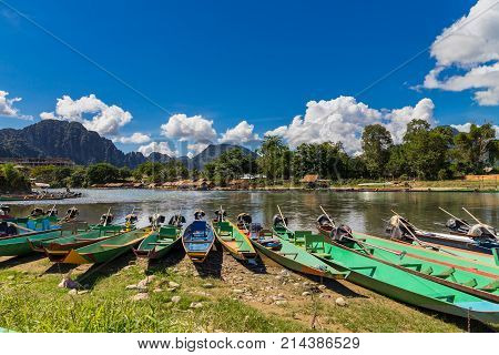 Long Tail Boats On Sunset At Song River, Vang Vieng, Laos.