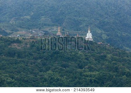 White big buddha aerial view with mountain background at Wat Prathat Phasornkaew Khao Kho Phetchabun Thailand