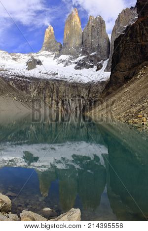 Torres del Paine reflecting in a lagoon