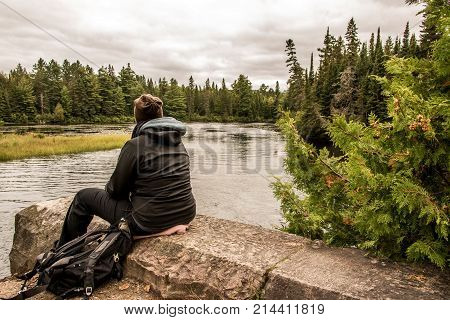 Girl Sitting Near Lake Of Two Rivers In Algonquin National Park Canada Ontario Natural Pinetree Land
