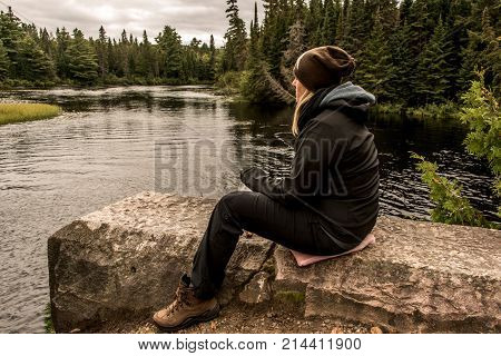 Girl Sitting Near Lake Of Two Rivers In Algonquin National Park Canada Ontario Natural Pinetree Land