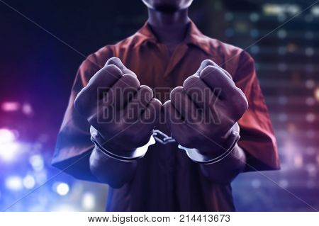 Arrested man in handcuffs on the stree