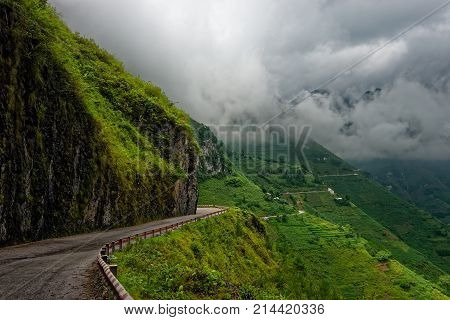 Mountain road before the rain is high in the mountains at the Ma Pi Leng pass in North Vietnam. The route travel Nature background.