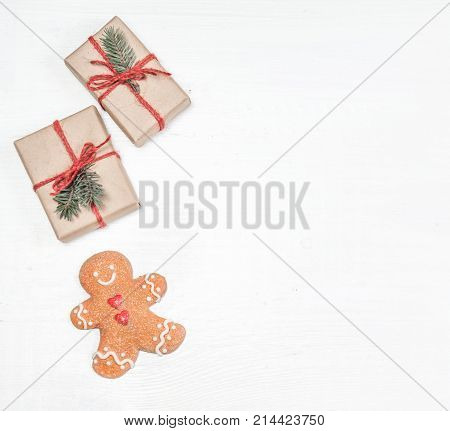 Christmas gifts fir tree branches xmas holiday decorations festive symbols on white wooden background with copyspace. Christmas composition.