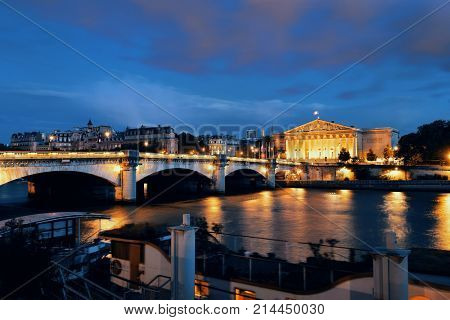 Paris River Seine with Pont de la Concorde and Assemblee Nationale at dusk