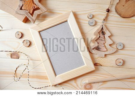 Wooden frame Christmas mockup, stock photography. Design works presentations, for bloggers and social media. Flat lay, top view photo mockup.