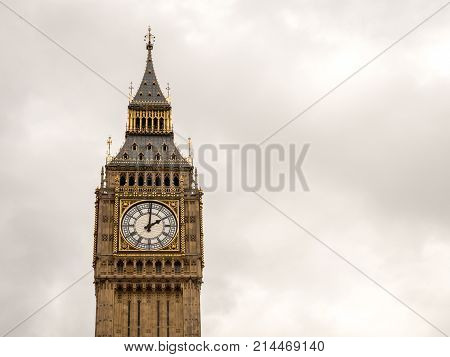 The iconic London landmark Big Ben at 2pm on a grey overcast day; with space for copy.