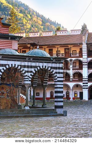 Bulgaria, Rila monastery view with autumn mountain trees at background