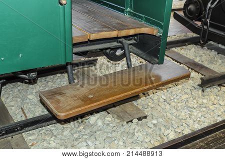 Staircase at the entrance to the locomotive's car. Close-up.