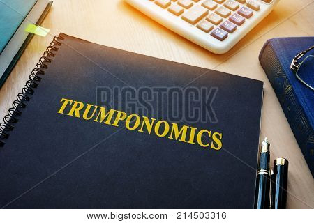 Book with title Trumponomics on an office desk.