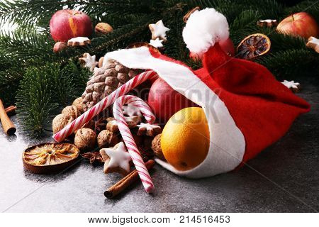 christmas cookies and santa had with spieses nuts and fruits.