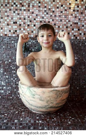 Portrait of a preschooler resting in hammam