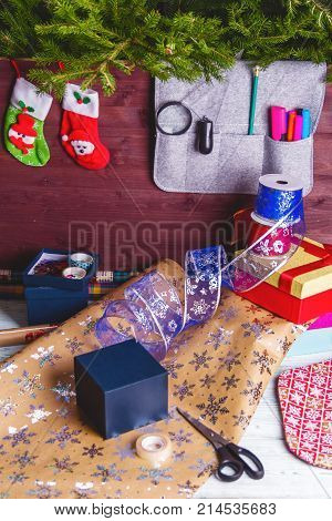 Package Christmas Gift Box. New Year Christmas Wrapping Paper, Ribbon, Bow And Thread, Scissors, Chr