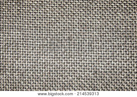 a cross of coarse dark cloth for the background