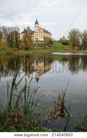 Old and historic castle Radun in the mirror of the pond, Northern Moravia, Czech Republic