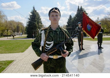 Yoshkar-Ola, Russia - April 30, 2016 A young cadet holds a submachine gun in the Shpagin system during a guard of honor in the central park of Yoshkar-Ola, Russia