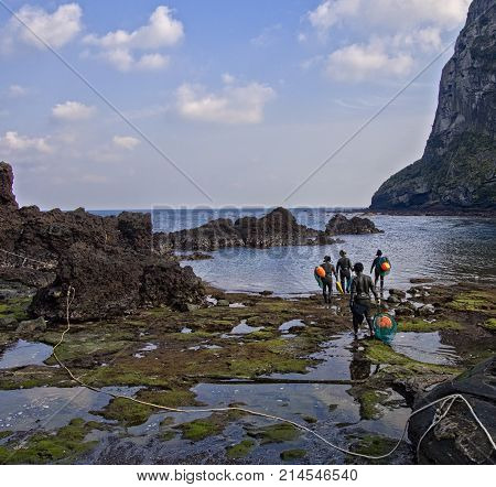 jeju south korea - 3rd november 2017: haenyeo traditional female fishing divers of jeju island. they considered a national treasure. The majority of the divers are above 50 years old with the oldest being 80.