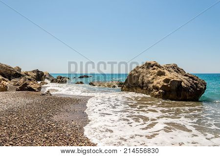 Coastline Landscape With A Large Rock On A Shore At The End Of Pissouri Beach, Cyprus