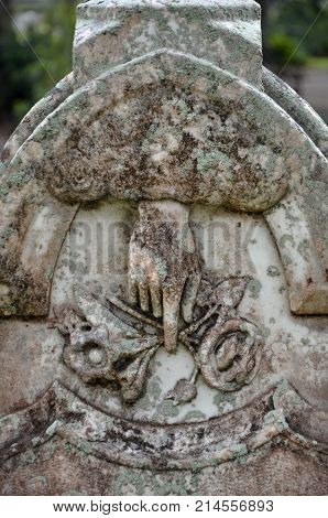 THUNDERBOLT, GA - October 8, 2017 Located in historic Bonaventure Cemetery, a monument's carvings depict the hand of God come from heaven to take the departed into his care.