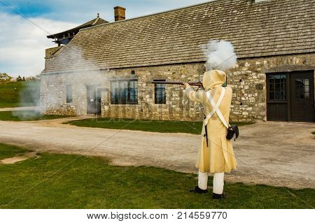 A Colonial Soldier demonstrating how to fire a Musket.