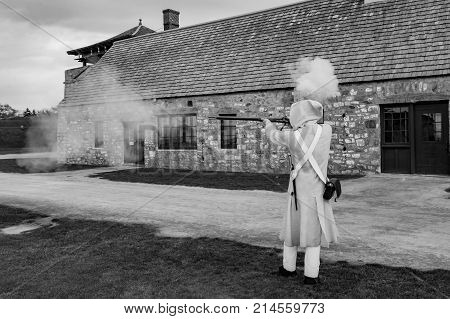 A Colonial Soldier demonstrating how to fire a Musket.