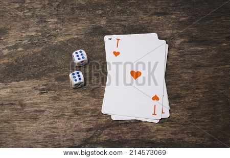 Ace of spades playing card top view and two game dice number double six