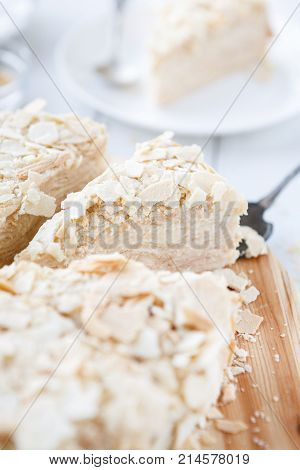 Portion of classic Napoleon cake closeup. Traditional millefeuille dessert with puff pastry and custard, russian cuisine treat, copy space