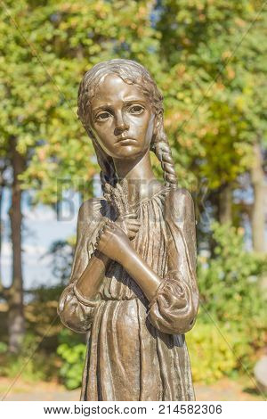 Kiev Ukraine October 08 2015: Sculpture of young girl with wheat ears in their hands known as the 