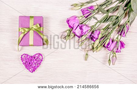 Pink heart and gift box on a white background. Valentine's Day.
