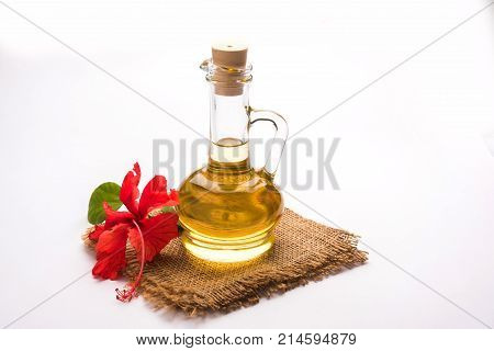 Jaswand or Hibiscus oil and bath soap/shampoo with flower and Reetha fruit and white towel