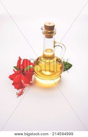 Jaswand or Hibiscus oil and bath soap/shampoo with flower and Reetha fruit and white towel