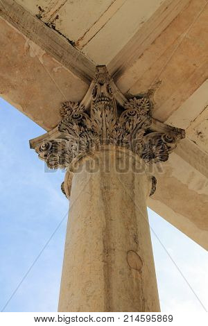 Marble supporting column seen from below with sky detail
