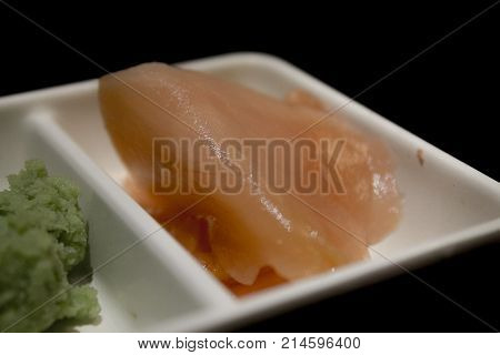 Plate of ginger and wasabi in Japanese restaurant